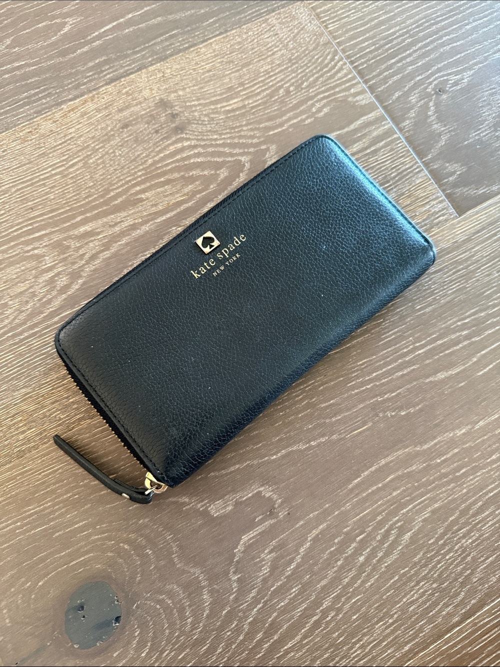 kate spade black pebbled leather zip-around wallet with gold logo